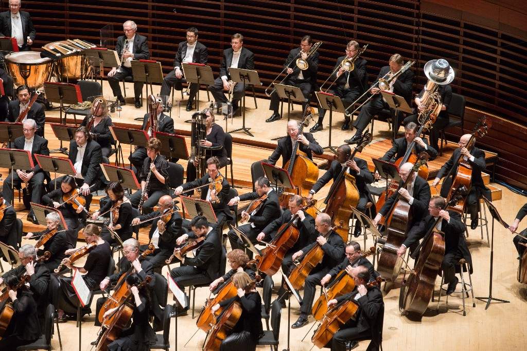 Cellos, violas, basses, winds and brass on stage